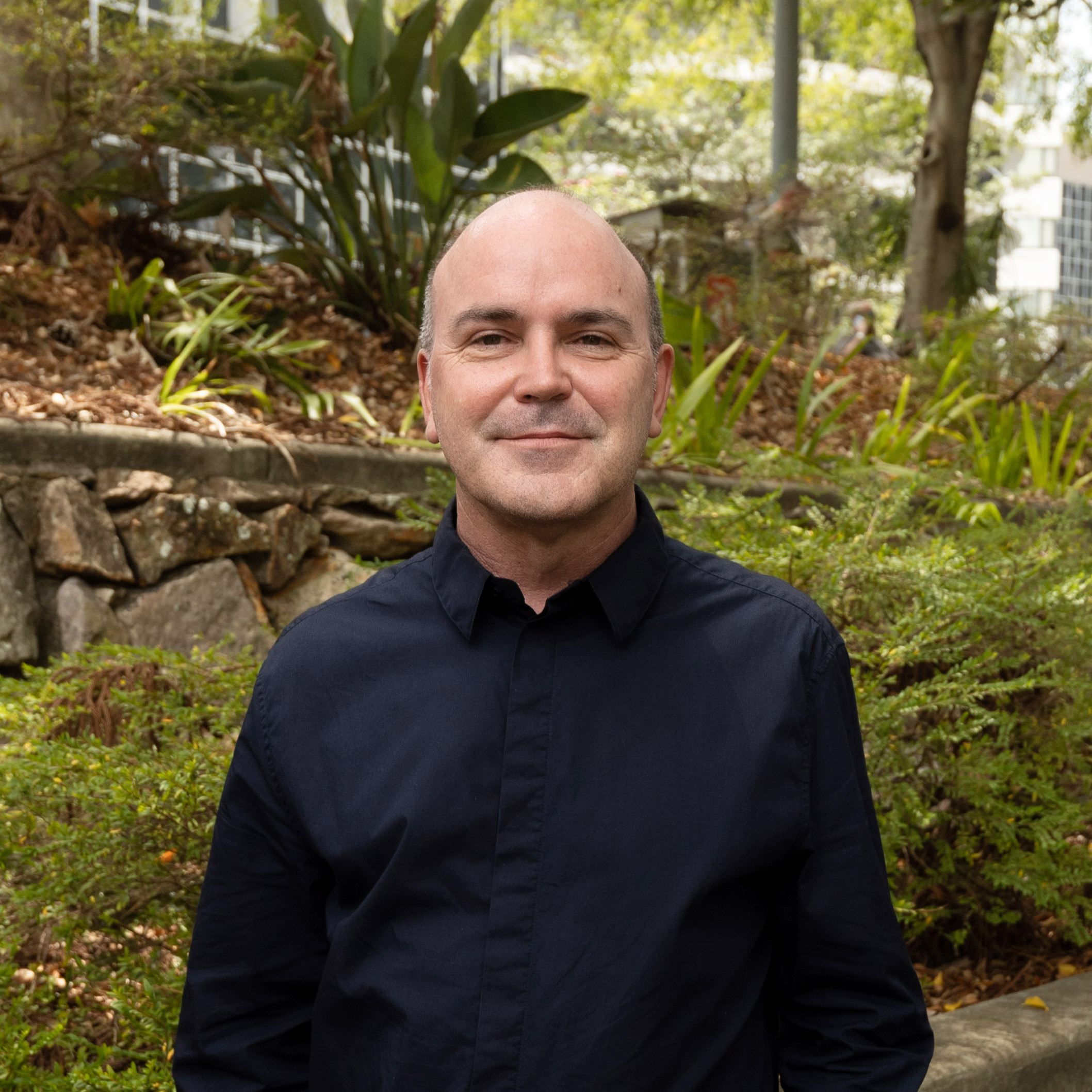 Fulton Trotter Director Paul Sekava standing in Roma Street Parkland.