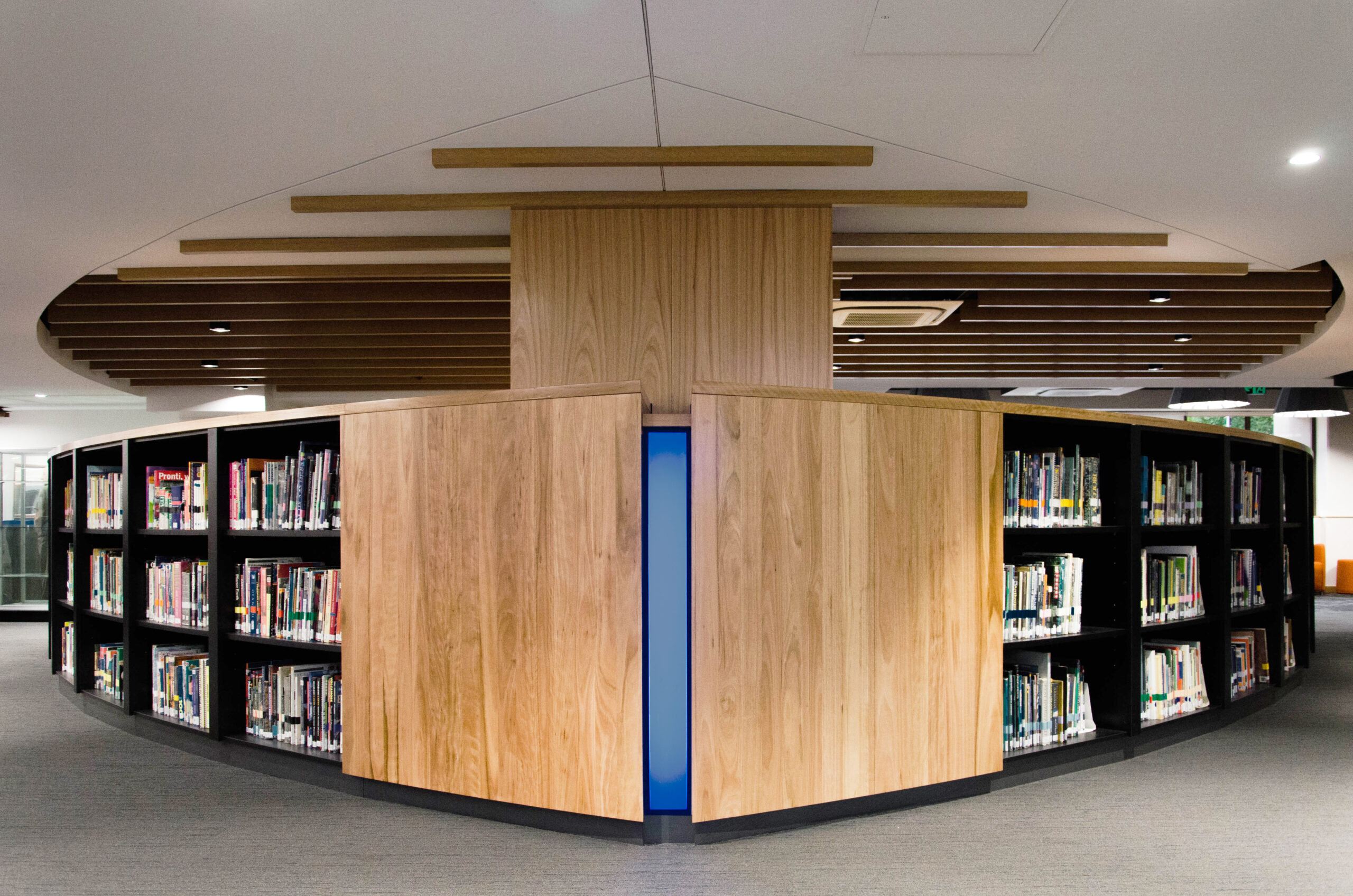 Wooden shelves create a central focus point in the library at St Marys Cathedral college