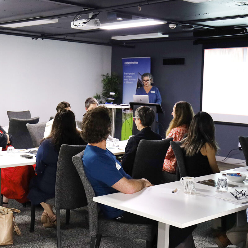 Director Katerina Dracopoulos presenting designing for neurodiversity in a boardroom at Springhill, Brisbane