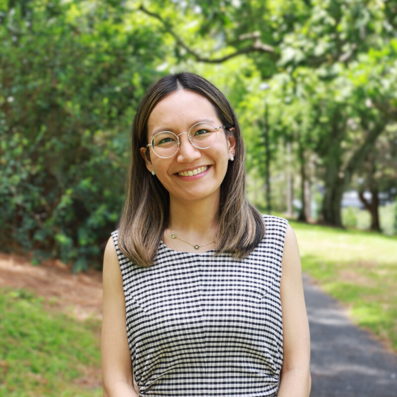 Fulton Trotter Architects' Coco Leung smiling in Roma Street Parklands.